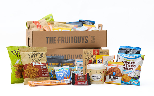 Cardboard trays of snacks, with more snacks in front
