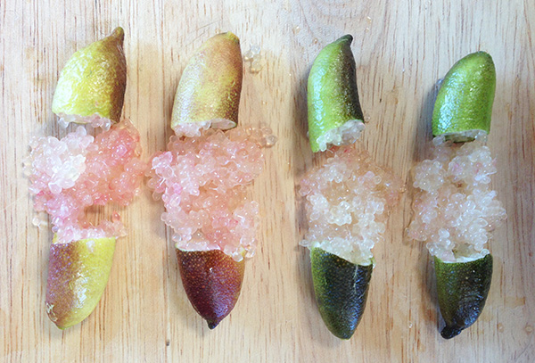 finger limes cracked open to show pearls