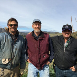 Smiling farmers on their far